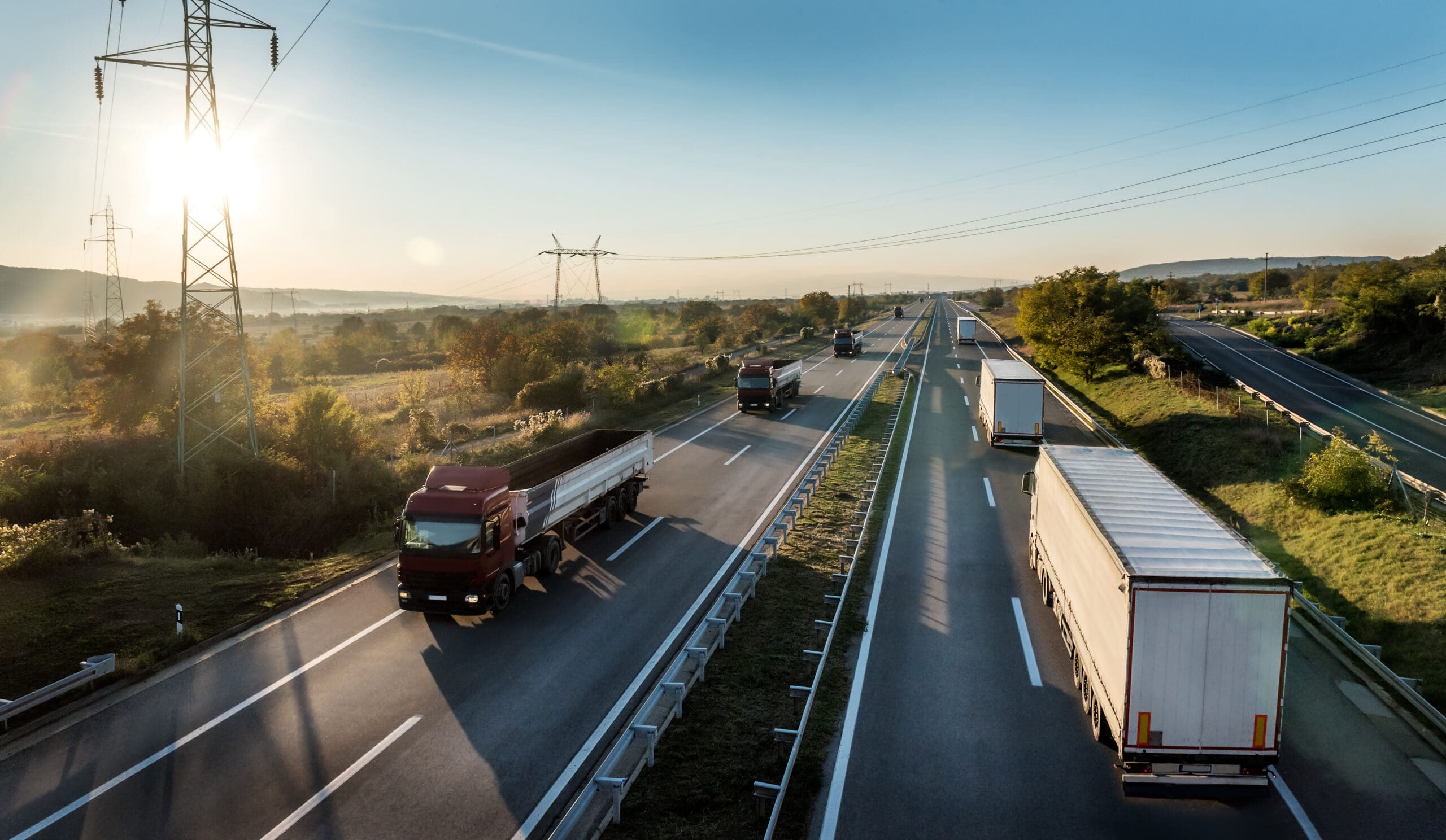 Convoys or caravans of transportation trucks passing on a highwa