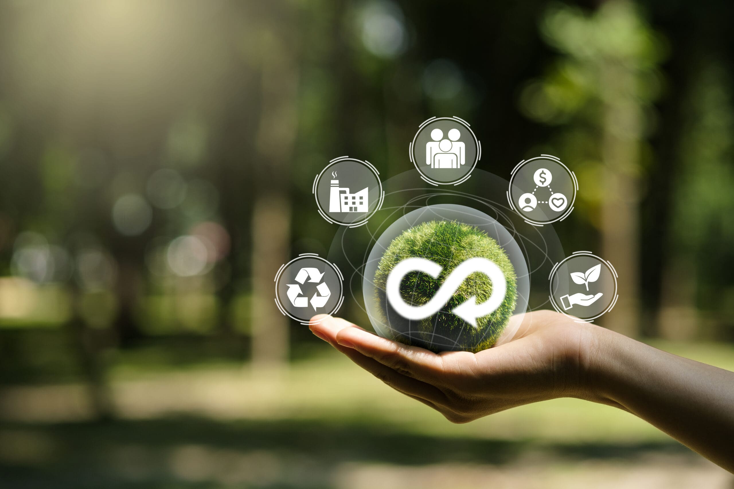 Hand of human holding green earth circular economy icon. Circula