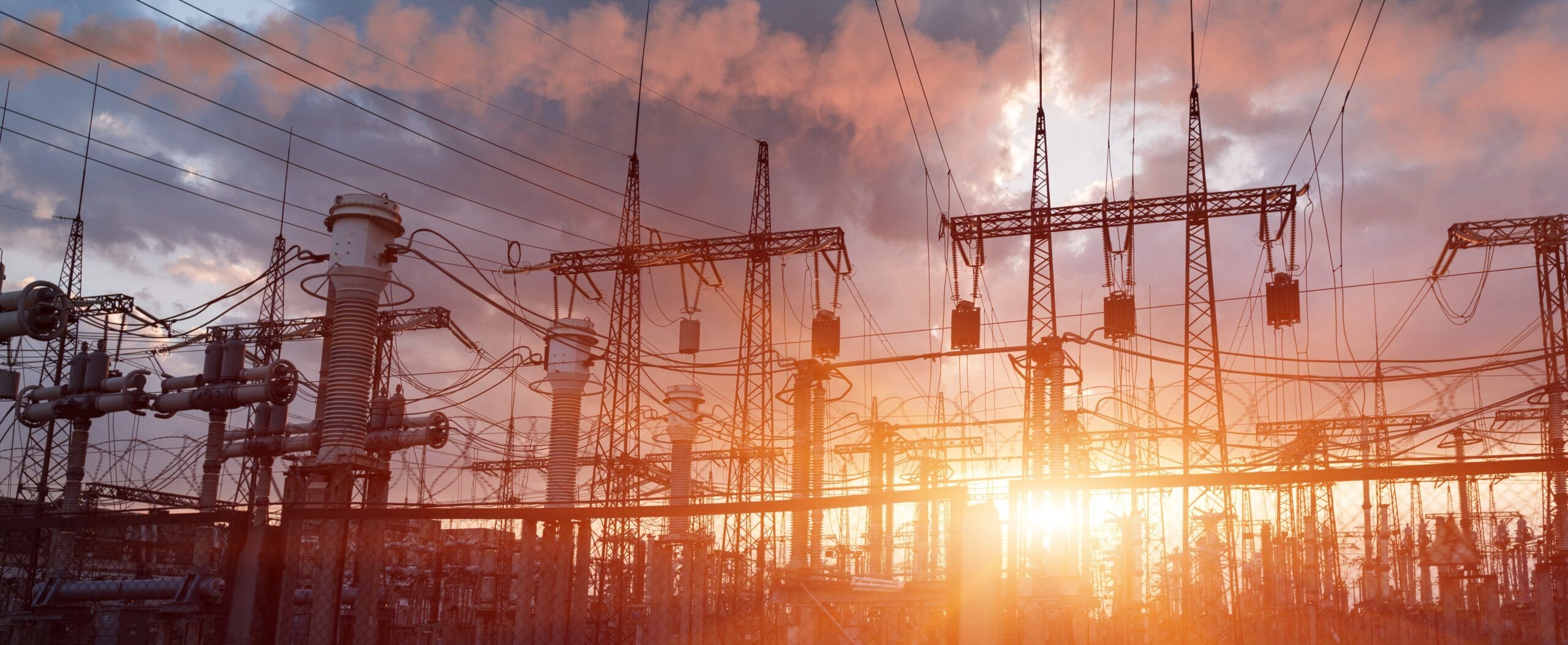 Thermal power stations and power lines during sunset.